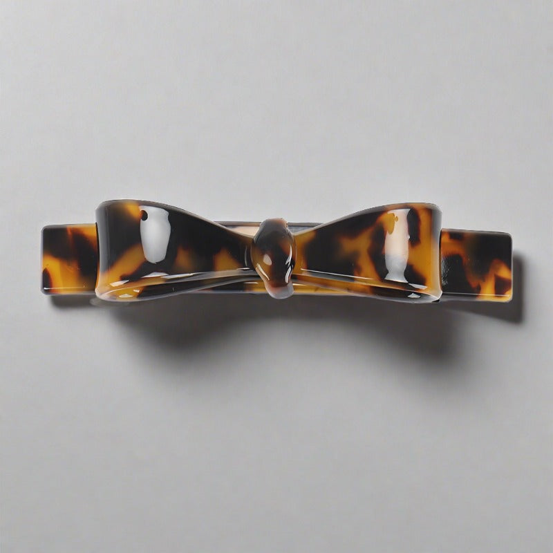 French bow barrettes hair clips.  This classic, petty ultra feminine style is a wardrobe style staple. Zoozh up any do and look effortlessly chic with a simple acetate bow barrette.