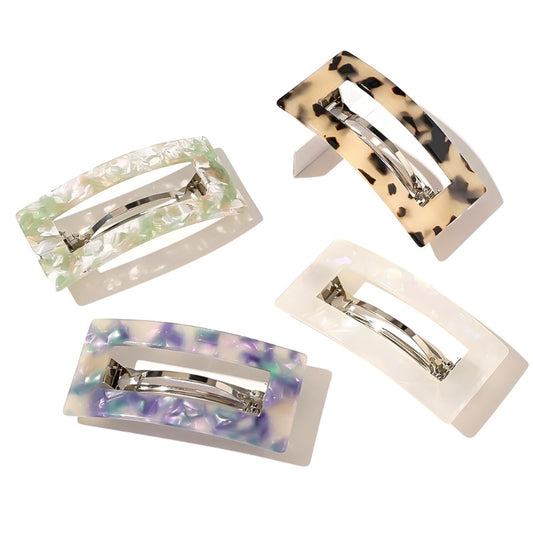 These versatile French barrettes have a flat base so they do not cause tension when holding your hair in place. Perfect for a half up half down 'do, the latch is strong enough to grip and a classic groomed all day style.