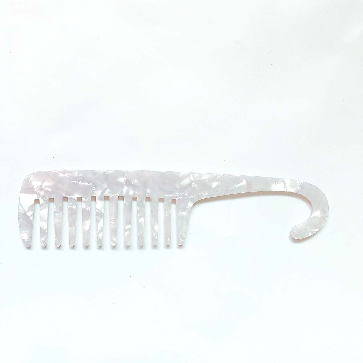 Wide tooth combs for use the bath and shower. These combs help to protect your hair and reduce damage to the strands when removing knots and tangles or working through hair conditioner