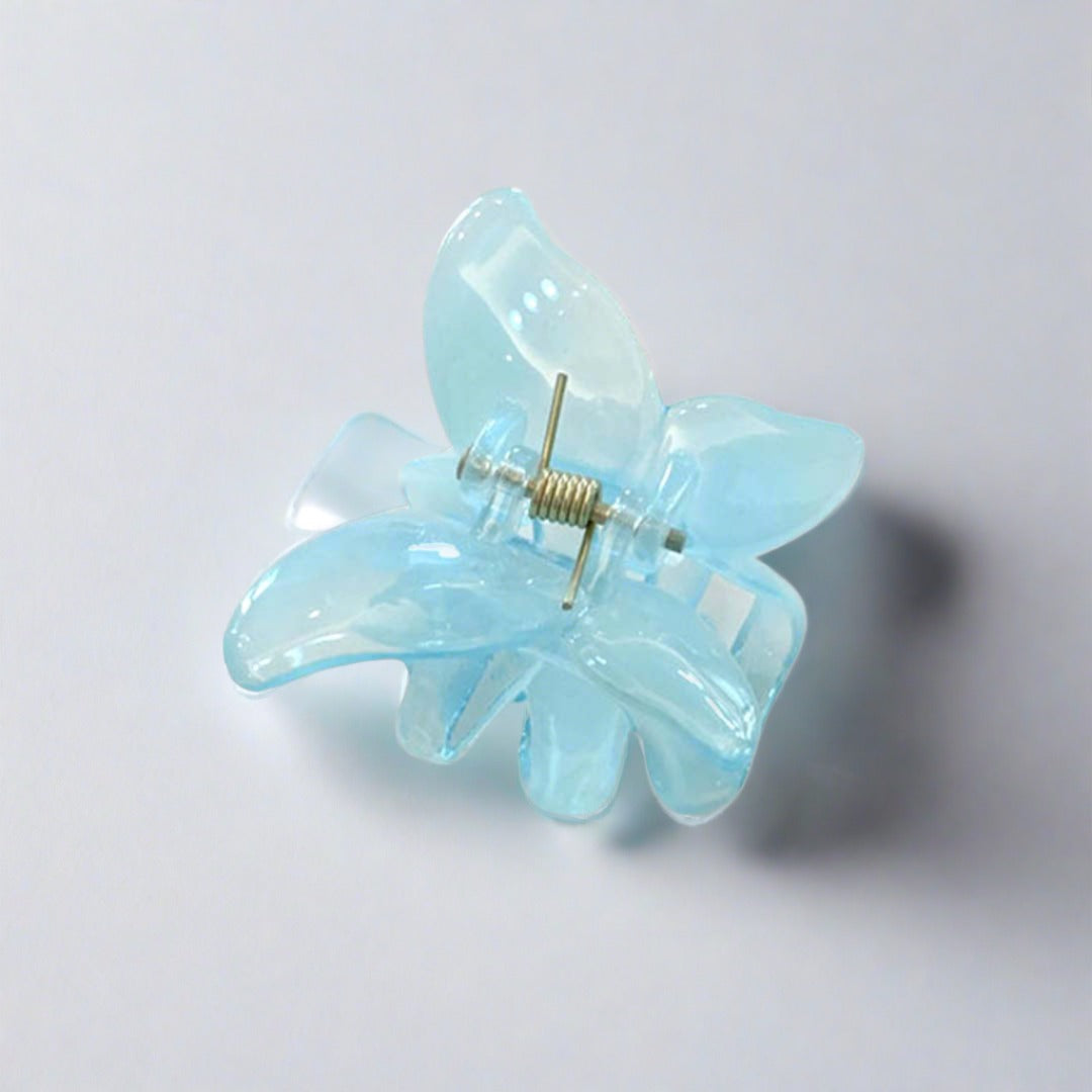 Butterfly shaped mini hair clip claw in acrylic acetate are so sweet.. but the clear acrylic lends a city edge that is not to be messed with.   Wear these cuties any which way you choose. They just as well clipped onto the shoulder step of a handbag, or the bottom of a shirt as they do in the hair - add a little je ne sais quois to the quotidien.