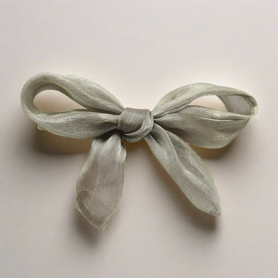 Double layered tulle bows on solid hair grips in soft hues to compliment most outfits, hair colours and styles. Clip these barrettes onto a pony tail, secure a side sweep or accent a half up half down do. Subtle, sweet, sophisticated but also kind of irresistibly cute bow barrettes.  stocking fillers