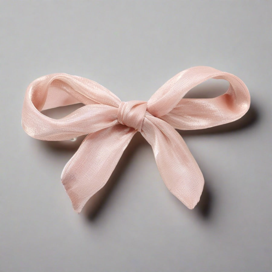 Double layered tulle bows on solid hair grips in soft hues to compliment most outfits, hair colours and styles. Clip these barrettes onto a pony tail, secure a side sweep or accent a half up half down do. Subtle, sweet, sophisticated but also kind of irresistibly cute bow barrettes.  stocking fillers