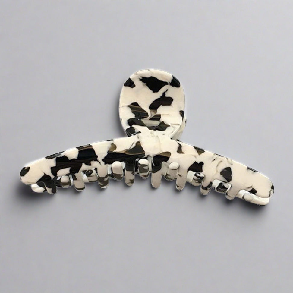 his gorgeous range of black and white speckled resin hair claw clips are ON PATROL! Add a point of focus to a monochrome outfit. Change a boring look with a simple emphasis. Imagine it.  Also known as hair jaws or crab clips, the patterns on every claw clip is unique. You may not receive a design that is identical to what is shown online. The colour placement is a guide only.